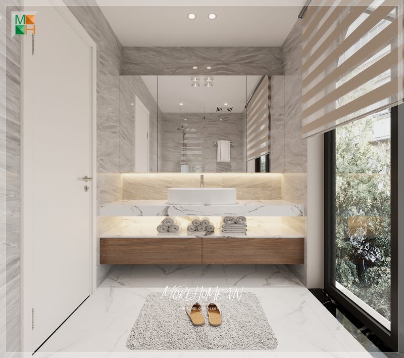 Khi bước vào căn phòng, bàn đá lavabo màu trắng kèm vân mây tinh tế sẽ giúp tạo cảm giác thoáng mát và sạch sẽ.