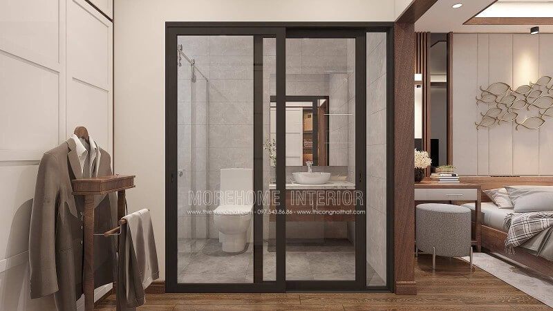 Bạn đang băn khoăn về cách thiết kế phòng tắm nam khép kín để giữ nguyên vẻ đẹp sang trọng khi sử dụng gỗ óc chó làm vật liệu chủ đạo thì ý tưởng thiết kế phòng tắm cửa kính trượt viền đen kết hợp không gian màu xám từ gạch ốp giả bê tông cùng tủ đựng đồ phòng tắm bề mặt đá vân mây với lớp cánh gỗ óc chó sẽ là gợi ý độc đáo và hợp lý cho các căn hộ chung cư, nhà phố, nhà liền kề, biệt thự.